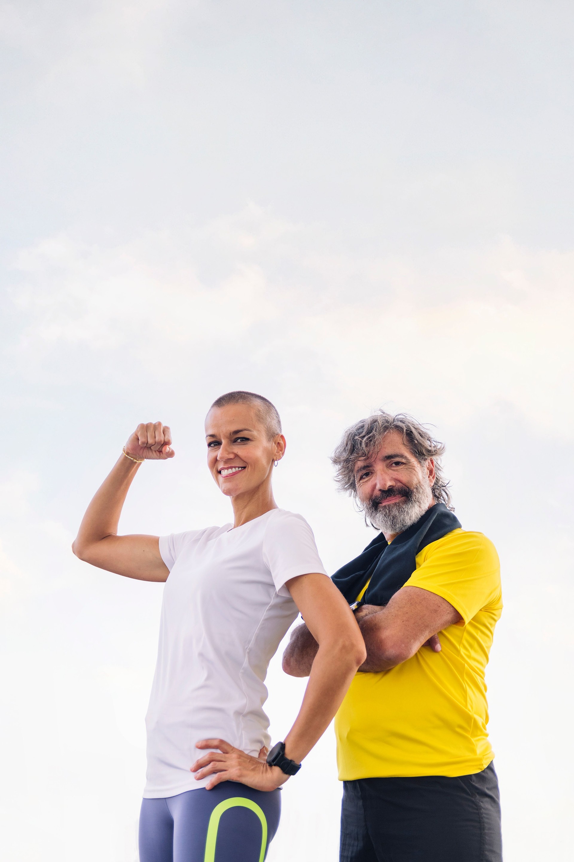 senior man and woman posing strong and confident